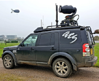 aerial camera filming trackingvehicle